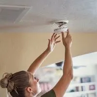 why Smoke alarm keeps going off at night